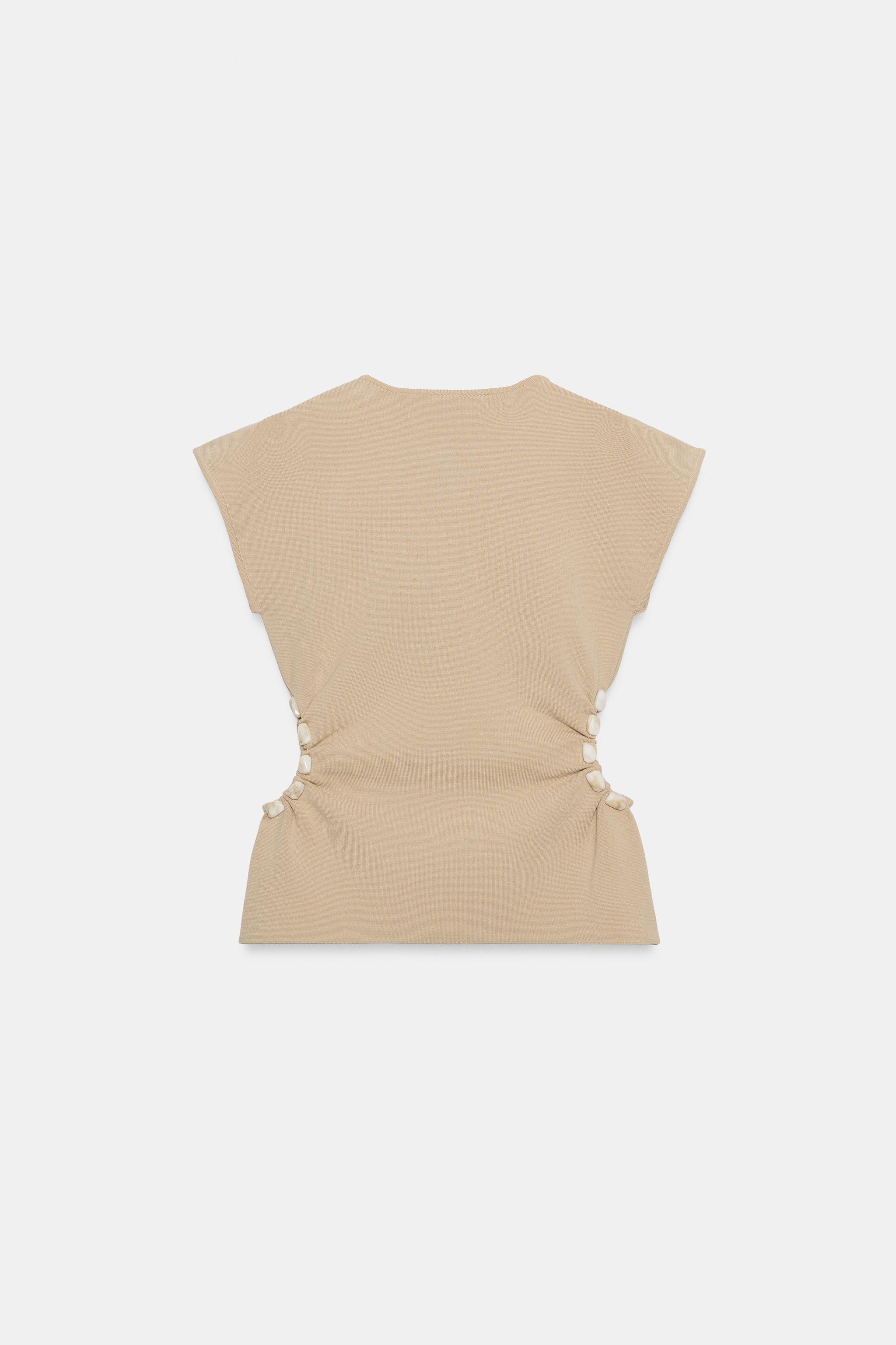 CUT OUT BEADED KNIT TOP